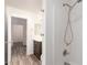 Bathroom featuring dark wood vanity with white countertop, walk-in shower, and neutral walls at 41598 N Ranch Dr, San Tan Valley, AZ 85140