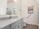 Neutral bathroom featuring a white vanity with marble countertop, toilet, and step-in shower at 41598 N Ranch Dr, San Tan Valley, AZ 85140