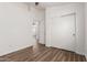 Bedroom with wood-look floors, a closet, neutral walls, and a ceiling fan at 41598 N Ranch Dr, San Tan Valley, AZ 85140