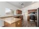 Spacious kitchen with stainless steel appliances, granite countertops, and ample storage space at 41598 N Ranch Dr, San Tan Valley, AZ 85140