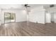 Spacious living room featuring high ceilings, wood-look floors, slider door and neutral tones at 41598 N Ranch Dr, San Tan Valley, AZ 85140