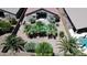 Aerial view of a home with beautiful palm trees around pool at 41847 W Sparks Ct, Maricopa, AZ 85138