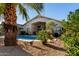 Beautiful swimming pool in landscaped backyard at 41847 W Sparks Ct, Maricopa, AZ 85138