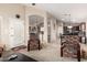 Open-concept living room with comfortable chairs, arched doorways, and easy flow to dining and kitchen at 41847 W Sparks Ct, Maricopa, AZ 85138