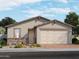 Charming single-story home featuring a two-car garage and a beautifully landscaped front yard at 4225 W Lisa Ln, San Tan Valley, AZ 85144