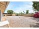 Large, low-maintenance backyard with gravel landscaping and block wall fencing at 4307 E Walatowa St, Phoenix, AZ 85044