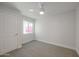 Bright bedroom with plush carpet, natural light, and neutral decor at 4307 E Walatowa St, Phoenix, AZ 85044