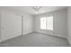 Clean bedroom with a large closet, window and neutral color scheme offers a peaceful retreat at 4307 E Walatowa St, Phoenix, AZ 85044