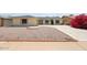 Charming single-story home with manicured gravel yard, mature bougainvillea, and a neatly paved driveway at 4307 E Walatowa St, Phoenix, AZ 85044