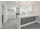 Kitchen featuring white cabinets, quartz countertops, stainless steel appliances, and a stylish island at 4307 E Walatowa St, Phoenix, AZ 85044