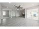 Open living space features modern tile flooring, ample natural light, and a ceiling fan at 4307 E Walatowa St, Phoenix, AZ 85044