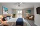 Comfortable bedroom with stylish decor, a ceiling fan, and access to the backyard at 4307 E Walatowa St, Phoenix, AZ 85044