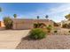 Charming single-story home featuring desert landscaping, an archway entrance, and an attached two-car garage at 4527 E Sunrise Dr, Phoenix, AZ 85044