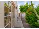 Exterior shot of the home, featuring a garden area, patio, and mature trees at 4527 E Sunrise Dr, Phoenix, AZ 85044