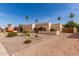 Single-story home featuring desert landscaping, an archway entrance, and an attached two-car garage at 4527 E Sunrise Dr, Phoenix, AZ 85044