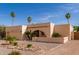 Single-story home with desert landscaping, archway entrance, and an attached two-car garage at 4527 E Sunrise Dr, Phoenix, AZ 85044