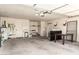 Spacious garage with lots of open space, overhead lighting, a storage area and a utility sink great for projects and storage at 4527 E Sunrise Dr, Phoenix, AZ 85044