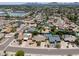 Scenic aerial of a neighborhood showcasing community pools and mature trees with mountain views at 4535 E Redfield Rd, Phoenix, AZ 85032