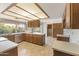 Well-lit kitchen boasts ample counter space, stainless steel appliances, and a large garden view window at 4535 E Redfield Rd, Phoenix, AZ 85032