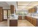 Bright kitchen featuring white countertops, stainless appliances, and a convenient breakfast bar at 4535 E Redfield Rd, Phoenix, AZ 85032