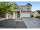 Charming two-story home featuring a two-car garage, a well-maintained front yard, and a welcoming entrance at 4615 S 23Rd Way, Phoenix, AZ 85040