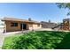 This backyard features a playset, patio, and artificial grass at 4624 S Fair Ln, Tempe, AZ 85282