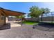 This backyard features a covered patio, a trampoline, and a playset at 4624 S Fair Ln, Tempe, AZ 85282