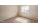 Carpeted bedroom features window, artwork, and natural light at 4624 S Fair Ln, Tempe, AZ 85282