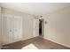 Bedroom with a closet, neutral walls, and an attached bathroom at 4624 S Fair Ln, Tempe, AZ 85282