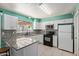 Modern kitchen with granite countertops and stainless steel appliances at 4624 S Fair Ln, Tempe, AZ 85282