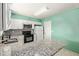 Bright kitchen with white cabinetry, stainless microwave and granite countertops at 4624 S Fair Ln, Tempe, AZ 85282