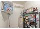 This pantry features plenty of shelving, an efficient water heater, and room to store at 4624 S Fair Ln, Tempe, AZ 85282
