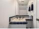 Charming bathroom featuring a uniquely tiled countertop sink and a well-lit mirror for a quaint feel at 4812 E Winston Dr # 2, Phoenix, AZ 85044