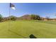 Golf course features lush green with desert landscape and mountain views at 4812 E Winston Dr # 2, Phoenix, AZ 85044