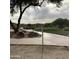 Peaceful community golf course pathway with mature trees providing shade and beautiful views at 4812 E Winston Dr # 2, Phoenix, AZ 85044