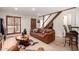 Inviting living room featuring a comfortable couch, wood-look floors, and rustic details for a cozy ambiance at 4812 E Winston Dr # 2, Phoenix, AZ 85044