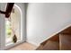 Bright staircase area featuring wood stairs, decorative vase in the window, and neutral wall colors at 4812 E Winston Dr # 2, Phoenix, AZ 85044