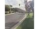 Street scene showcasing neighborhood with lush green landscape, mature trees, and mountain backdrop at 4812 E Winston Dr # 2, Phoenix, AZ 85044