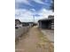 Spacious backyard with a dirt terrain and alley access at 527 S Macdonald --, Mesa, AZ 85210