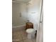 Bathroom featuring toilet, tub, shower, and tile flooring at 527 S Macdonald --, Mesa, AZ 85210