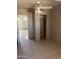 Bedroom featuring tile flooring, ceiling fan, and closet at 527 S Macdonald --, Mesa, AZ 85210
