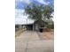 Charming single-story home with a covered carport and a large tree at 527 S Macdonald --, Mesa, AZ 85210