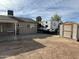 Backyard of home featuring a shed and RV/boat parking next to the house at 538 E Glade Ave, Mesa, AZ 85204