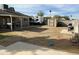 Spacious backyard of home with an RV/boat parked behind the house, grilling station, and shed at 538 E Glade Ave, Mesa, AZ 85204