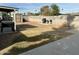 View of backyard, featuring a grill station, shed, and covered patio at 538 E Glade Ave, Mesa, AZ 85204