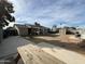 Wide view of the backyard featuring a picnic table, shed, RV parking, and outdoor seating at 538 E Glade Ave, Mesa, AZ 85204