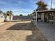 View of backyard featuring a grilling area, picnic table, and partial view of patio and block wall at 538 E Glade Ave, Mesa, AZ 85204
