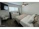 Bright bedroom boasts large windows, ceiling fan, and ample closet space at 538 E Glade Ave, Mesa, AZ 85204