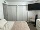 Comfortable bedroom features a fan and two large closets at 538 E Glade Ave, Mesa, AZ 85204