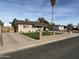 Attractive home featuring a modern yard, privacy fence, and convenient carport at 538 E Glade Ave, Mesa, AZ 85204